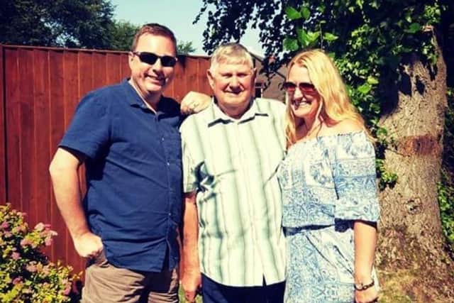 David Brown, centre, with children Darran Brown and Deborah Ellison