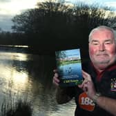 Cliff Peters at Bickershaw Country Park with his book of walks