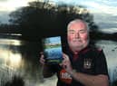 Cliff Peters at Bickershaw Country Park with his book of walks