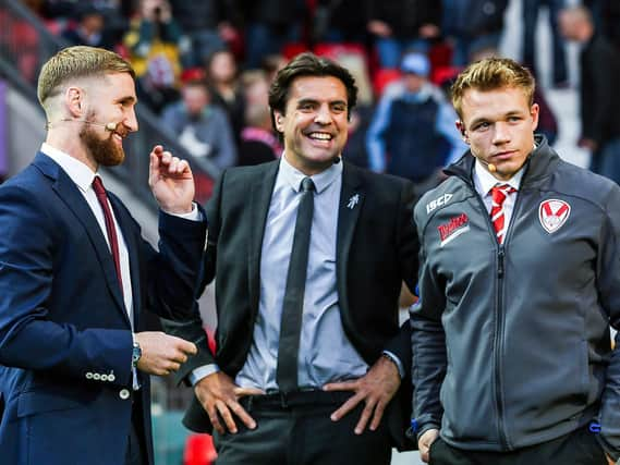 Sky Sports' Brian Carney shares a joke with Sam Tomkins and St Helens' Jonny Lomax