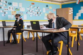 Prime Minister Boris Johnson visits Sedgehill School in south east London and takes part in an online class on February 23 (Photo by Jack Hill - WPA Pool/Getty Images)