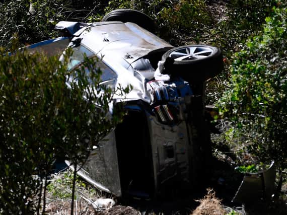 The vehicle driven by golfer Tiger Woods lies on its side in Rancho Palos Verdes, California after a rollover accident.