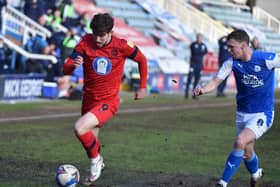 Callum Lang battles hard against Peterborough