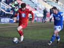 Callum Lang battles hard against Peterborough