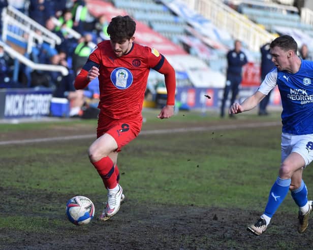 Callum Lang battles hard against Peterborough