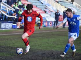 Callum Lang battles hard against Peterborough