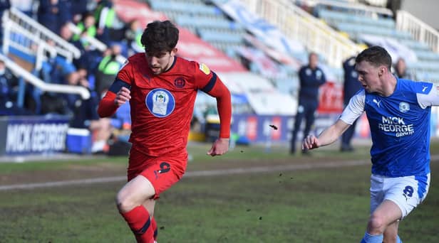 Callum Lang battles hard against Peterborough