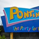 The owner of Pontins has entered into a legal agreement with the human rights watchdog