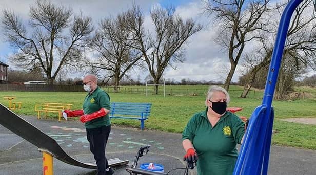 Volunteers gets spraying with anti-bacterial cleaning products in public spaces