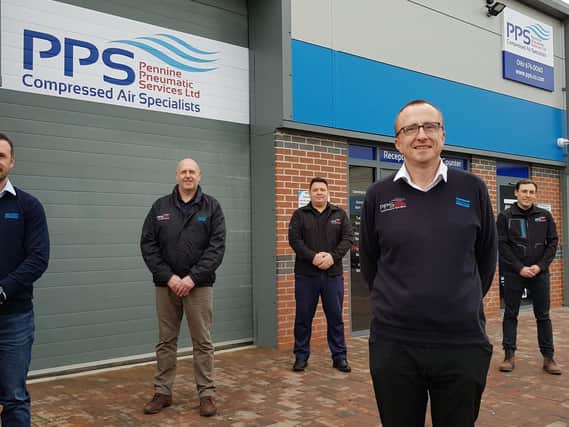Staff outside the new PPS branch in Leigh