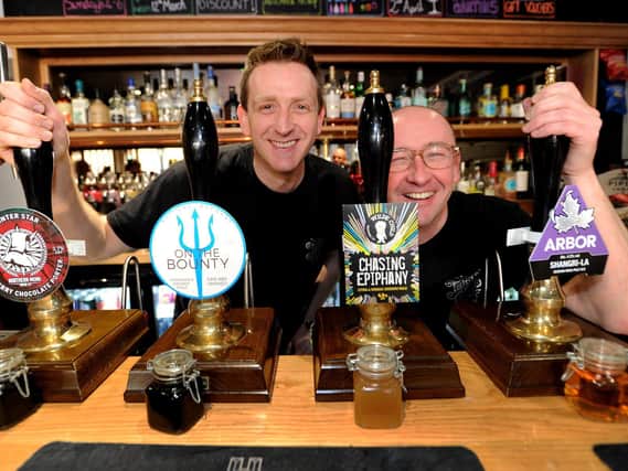 Stuart Hurst and Bob Nelson behind the bar of the Twisted Vine