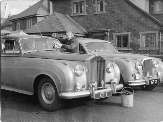 George Formby with his personalised Rolls Royce cars at his home