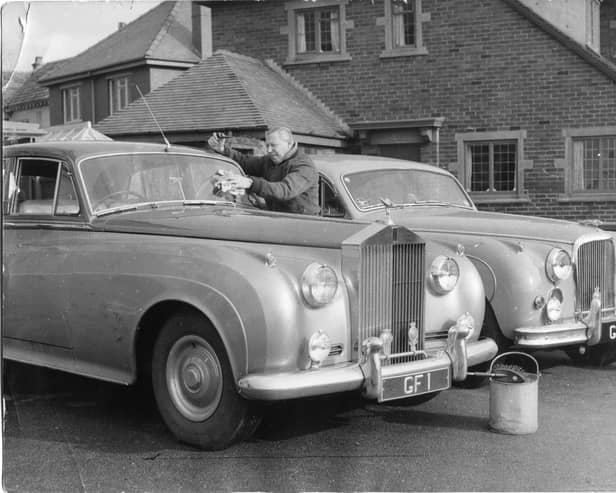 George Formby with his personalised Rolls Royce cars at his home