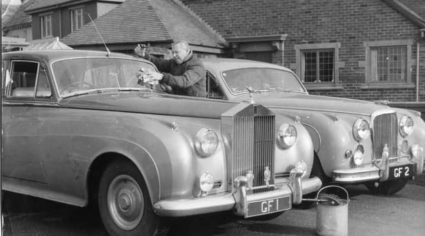 George Formby with his personalised Rolls Royce cars at his home