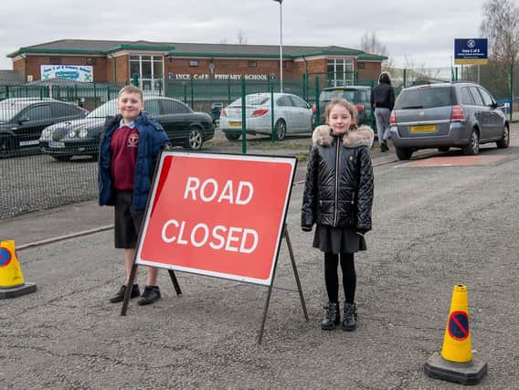 Ince CE Year 5 pupils Jayden-Kai and Darcie with a message to motorists