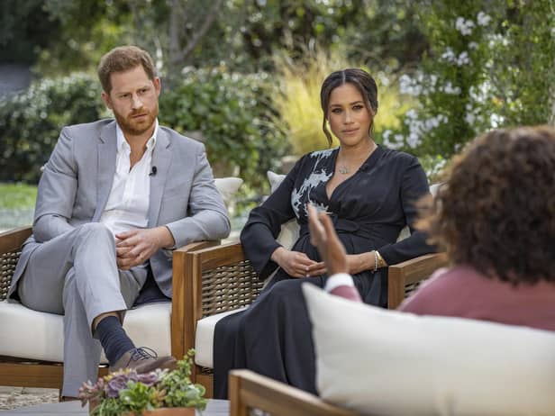 The Duke and Duchess of Sussex talking to Oprah Winfrey