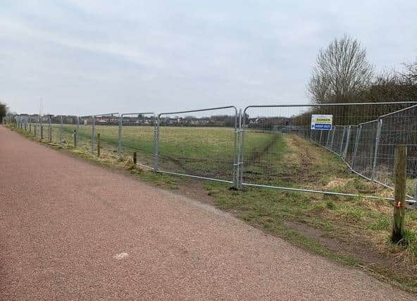 The fenced off field