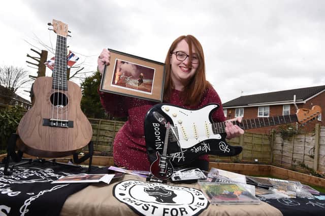 Sarah Hardman with some of the items in the music-themed raffle
