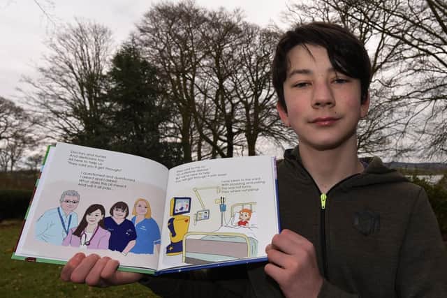 Sam Grant with his children's book about type one diabetes