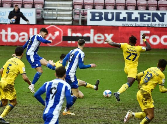 Jamie Proctor scores his first goal for Latics against Wimbledon