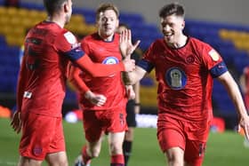 Jamie Proctor celebrates opening the scoring for Latics at Wimbledon