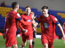 Jamie Proctor celebrates opening the scoring for Latics at Wimbledon