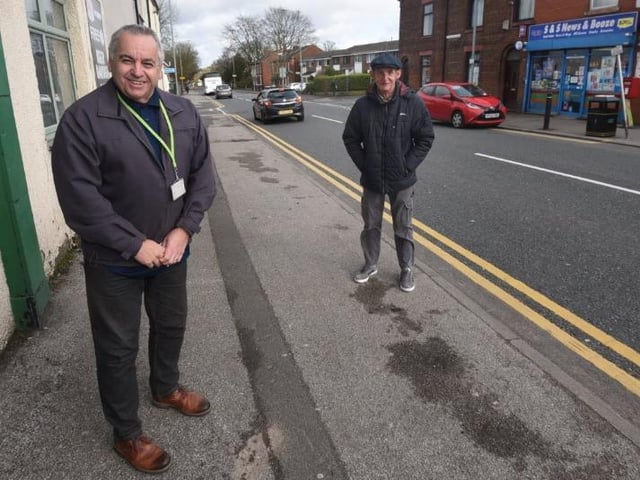 Coun Paul Blay and Coun Jim Talbot next to the busy road