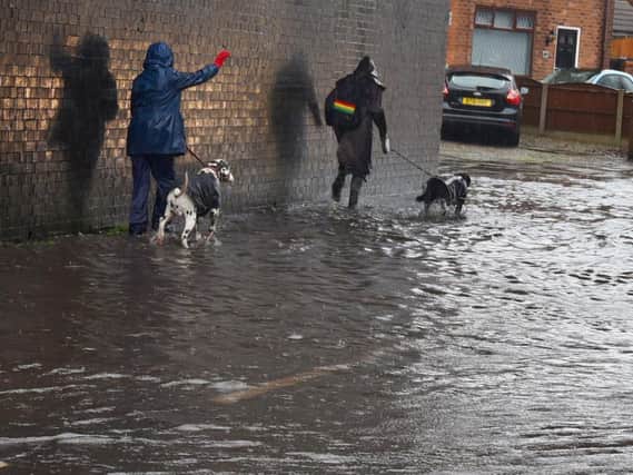 The road and pathway flooded on Buckley Street, Wigan, after heavy rainfall after Storm Christoph hit the borough.