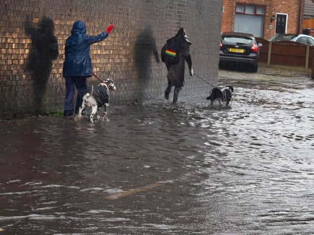 The road and pathway flooded on Buckley Street, Wigan, after heavy rainfall after Storm Christoph hit the borough.
