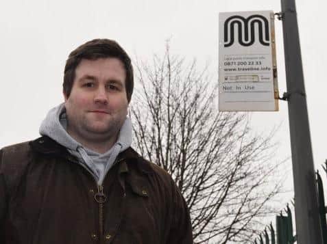 Coun Adam Marsh at a bus stop that is not in use on Bradley Lane, Standish