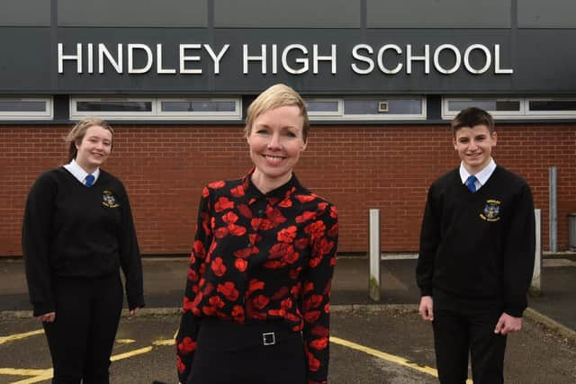 Acting headteacher Jude Norman with head girl Rebecca Cowburn and head boy Charlie White