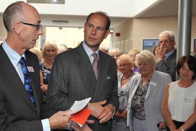 Dr Alan Baron welcomes Prince Edward to Wigan and Leigh Hospice