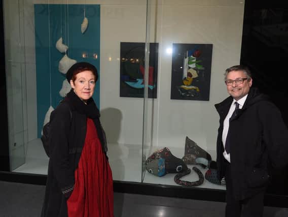 Jane Fairhurst and Coun Chris Ready with some of the artwork being displayed