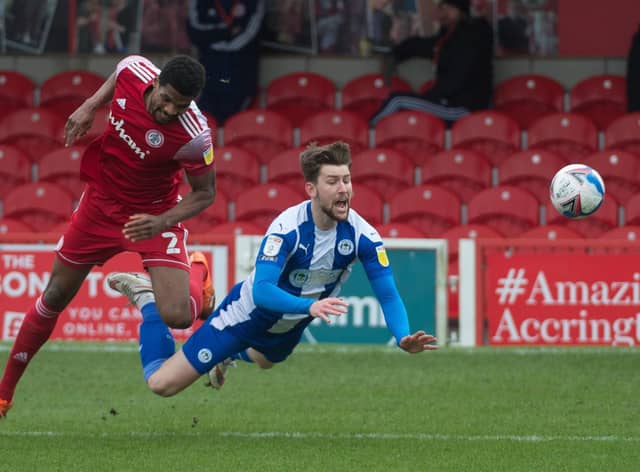 Callum Lang is sent tumbling at Accrington