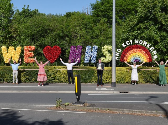 Some of the florists with the display in the community garden