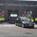 A guard of honour for Peter Millington's cortege at Wigan Fire and Ambulance Station