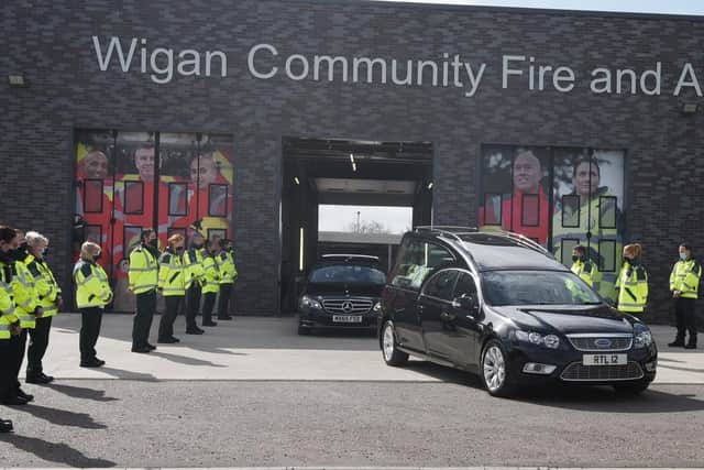 A guard of honour for Peter Millington's cortege at Wigan Fire and Ambulance Station