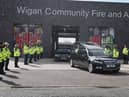 A guard of honour for Peter Millington's cortege at Wigan Fire and Ambulance Station