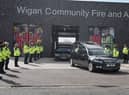A guard of honour for Peter Millington's cortege at Wigan Fire and Ambulance Station