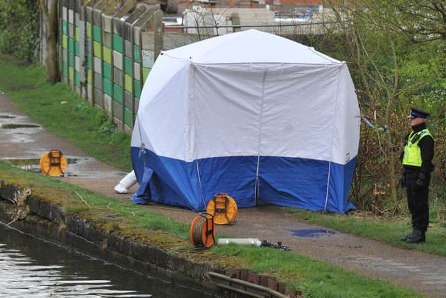 A tent has been erected on the canal towpath