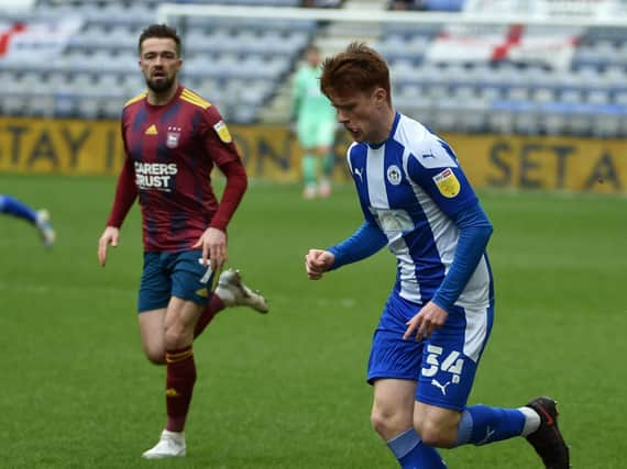 Luke Robinson in action for Latics against Ipswich