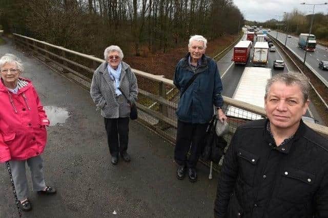 Members of Friends of Ashton pictured on the bridge over M6 near Ashton (junction 24), from left, Pat Grimshaw, Ethel Glover, Don Hodgkinson and Paul Tushingham