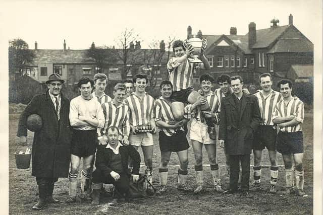 One of the pictures featured on the display of St Wilfrids celebrating after winning the local Division 1 trophy, with captain Curly Marsden holding the trophy aloft