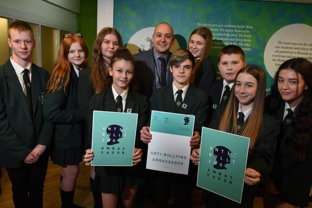 Pupils at Hindley High School have taken part in the Diana Award Anti-Bullying Ambassador scheme, from left, Tyler Morir, 14, Jenny Winrow, 13, Jodie Hock, 15, Evie White, 13, deputy headteacher Matt Taylor, Ryan Lightfoot, 15, Caitlin Sweetman, 14, Alfie Hough, 14, Georgia Bradshaw, 15, and Olivia Ridsdale, 15.