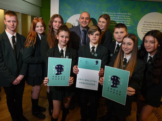 Pupils at Hindley High School have taken part in the Diana Award Anti-Bullying Ambassador scheme, from left, Tyler Morir, 14, Jenny Winrow, 13, Jodie Hock, 15, Evie White, 13, deputy headteacher Matt Taylor, Ryan Lightfoot, 15, Caitlin Sweetman, 14, Alfie Hough, 14, Georgia Bradshaw, 15, and Olivia Ridsdale, 15.