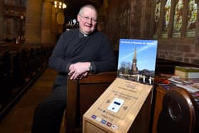 Reverend Andrew Holliday with the payment machine