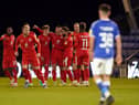The Wigan players celebrate at Oldham