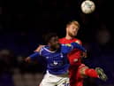 Jack Whatmough wins the ball at Oldham