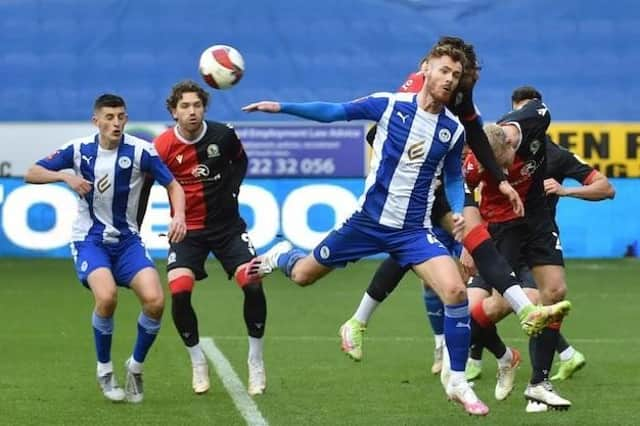 Tom Naylor competes for the ball against Blackburn