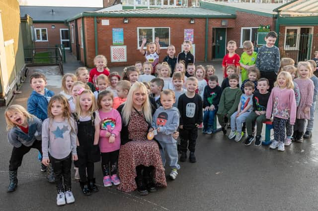 Susan Robbins surrounded by her pupils